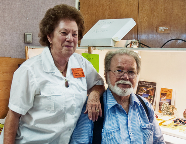 Gladys Walker and Simon King running the raffle at Gem Diego in 2013.